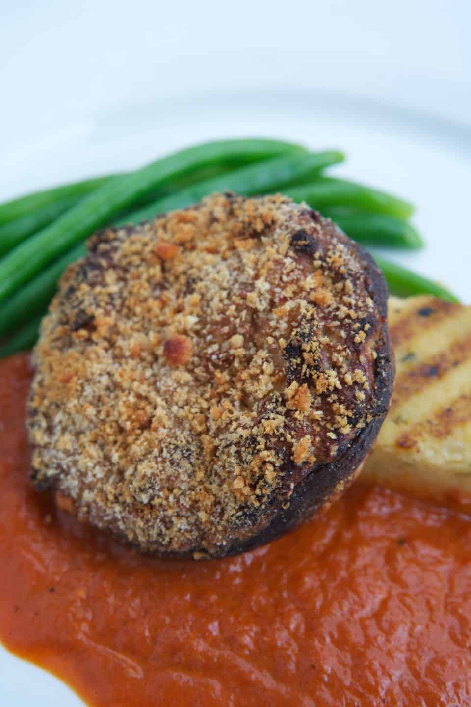 Image of Ricotta & Walnut Stuffed Field Mushroom On Herbed Polenta With Buttered French Beans And Roast Pepper & Port Jus, Chefs Pencil