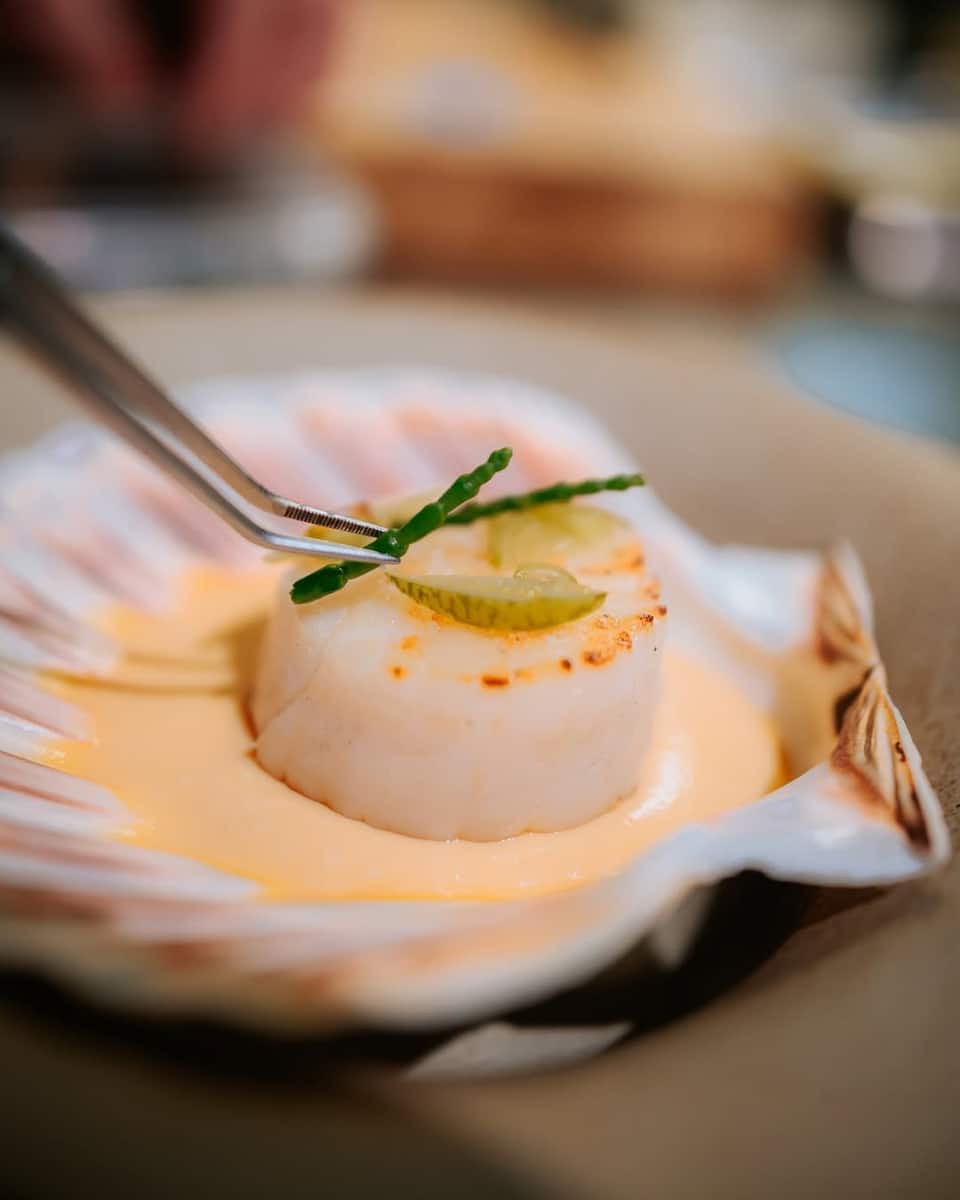 Diver-picked scallop gently cooked in scallop butter and grilled, served with chawanmushi made from the roe and scallop dashi from the skirt. Photo Credit: Kontrast;