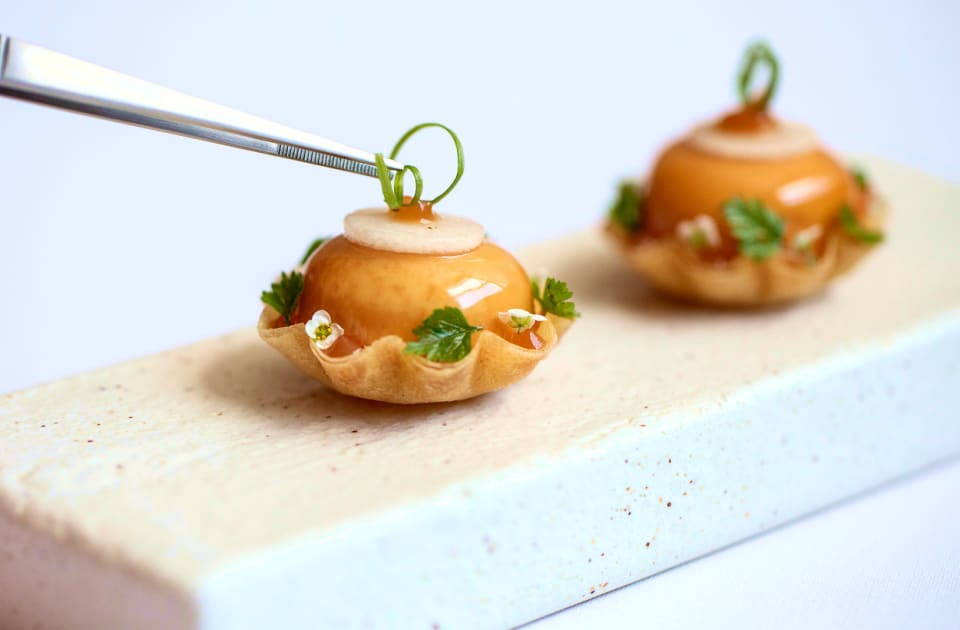 Stinking Bishop tarts with garden pear, alyssum flowers and chives