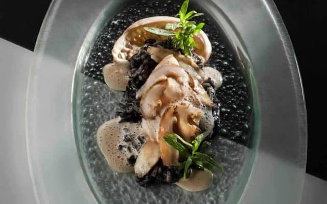 Pan-seared Abalone with Squid-Ink Risotto - Chef's Pencil
