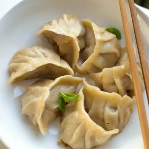 Pork Dumplings with Honey, Soy & Garlic Dipping Sauce Chef's Pencil