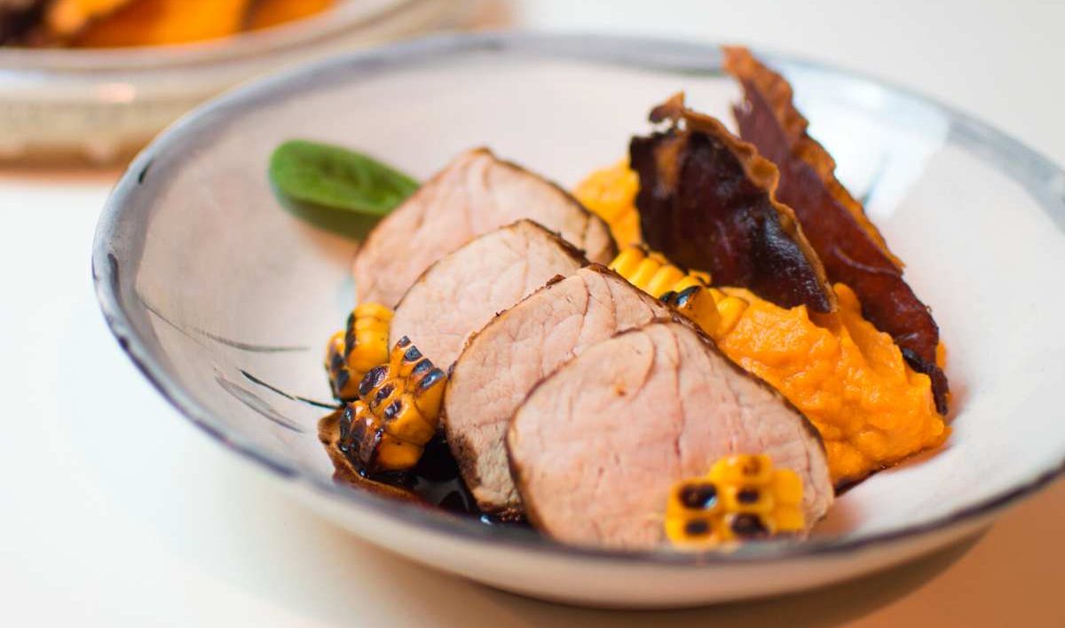 Pork tenderloin with mashed sweet potatoes and corn