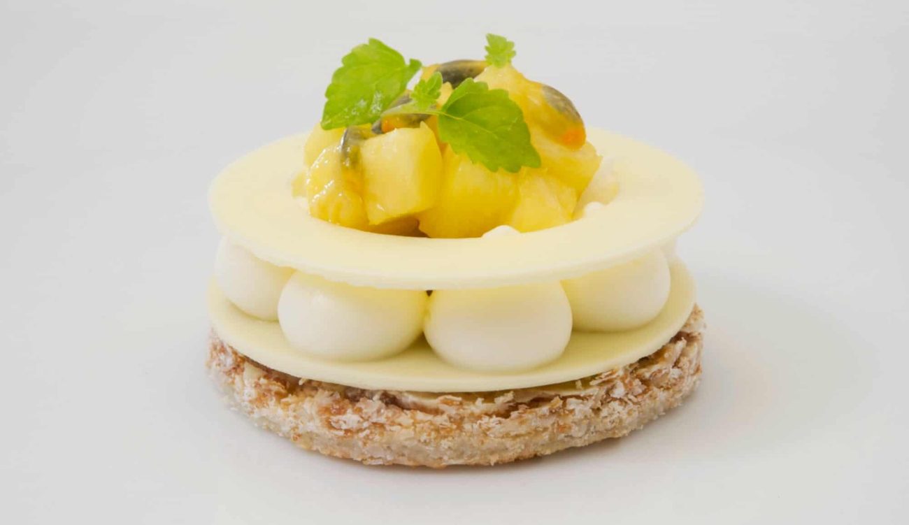 Coconut Dacquoise w/ Piña Colada Cream & Tropical Compote